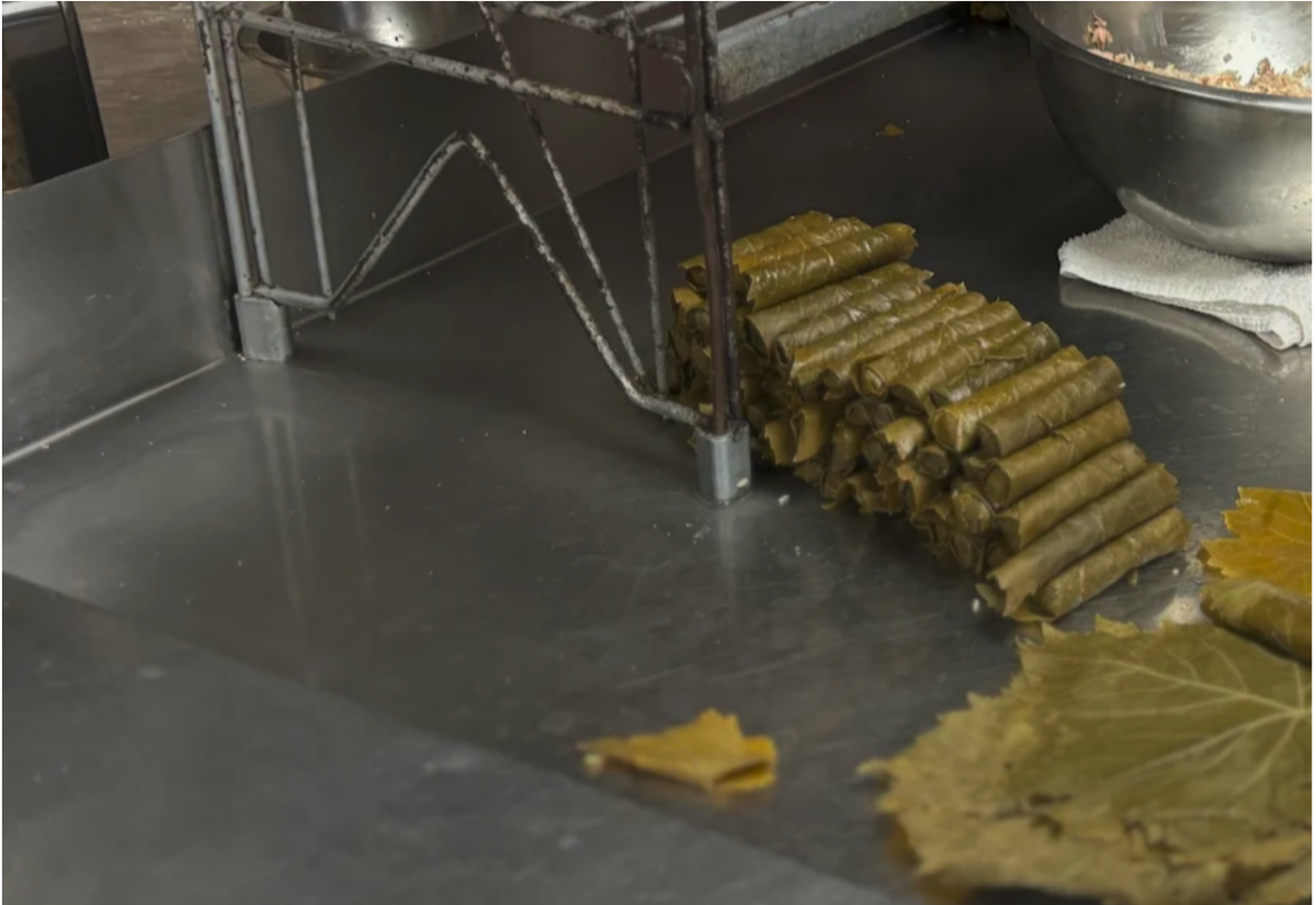 Stuffed grape leaves are prepared daily by hand in the front of the kitchen. The family begins preparations at 3:00 a.m.